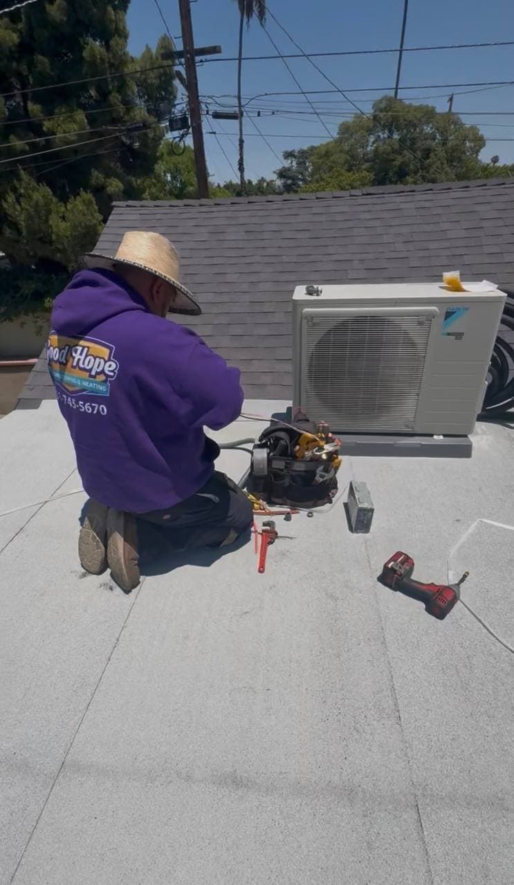 A Good Hope crew installing a new AC condenser unit